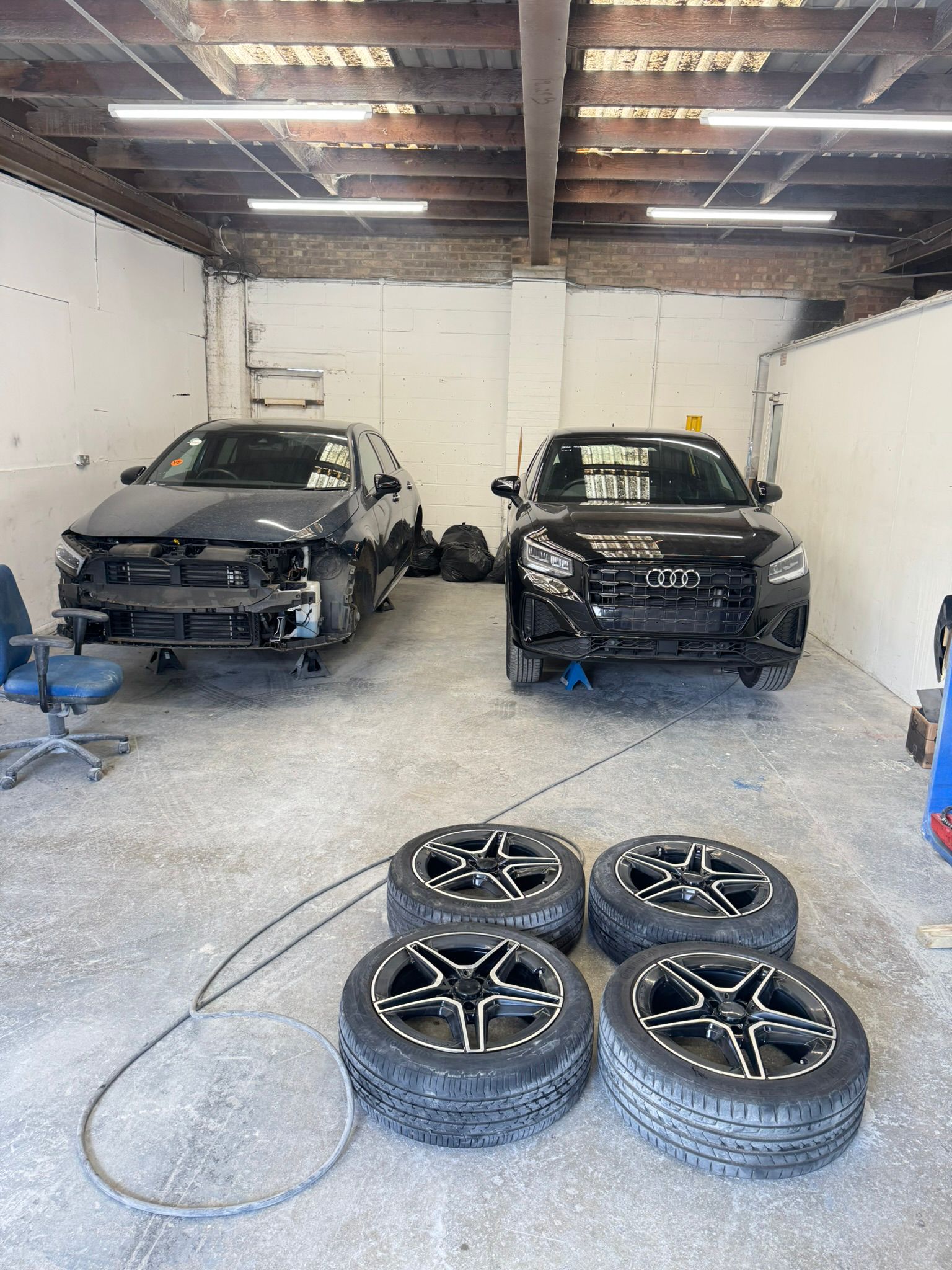 A car being worked on inside the garage