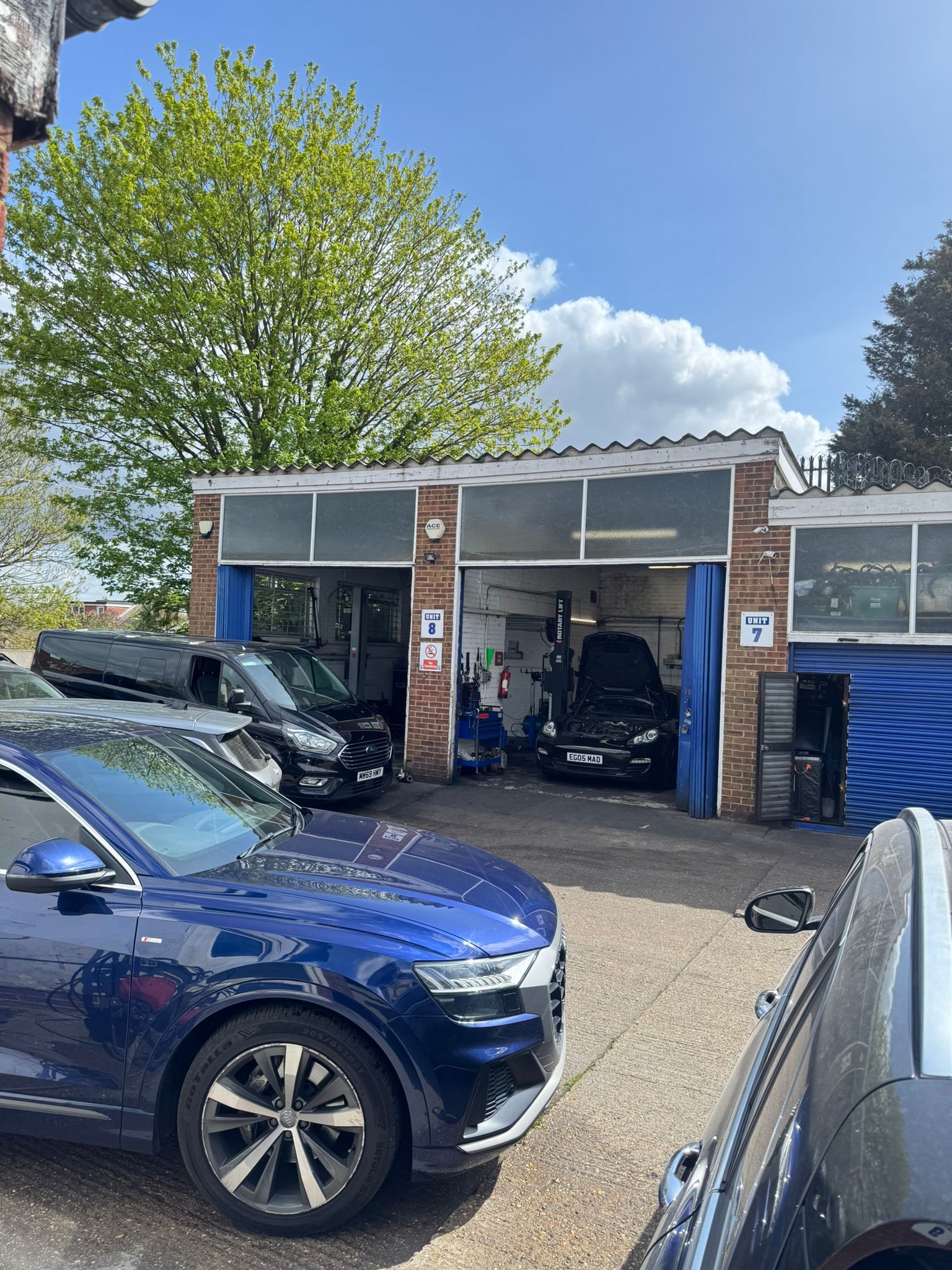 Cars parked outside the garage